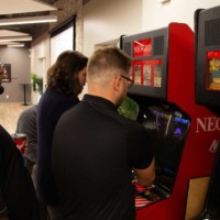 Plexxis team members playing arcade games